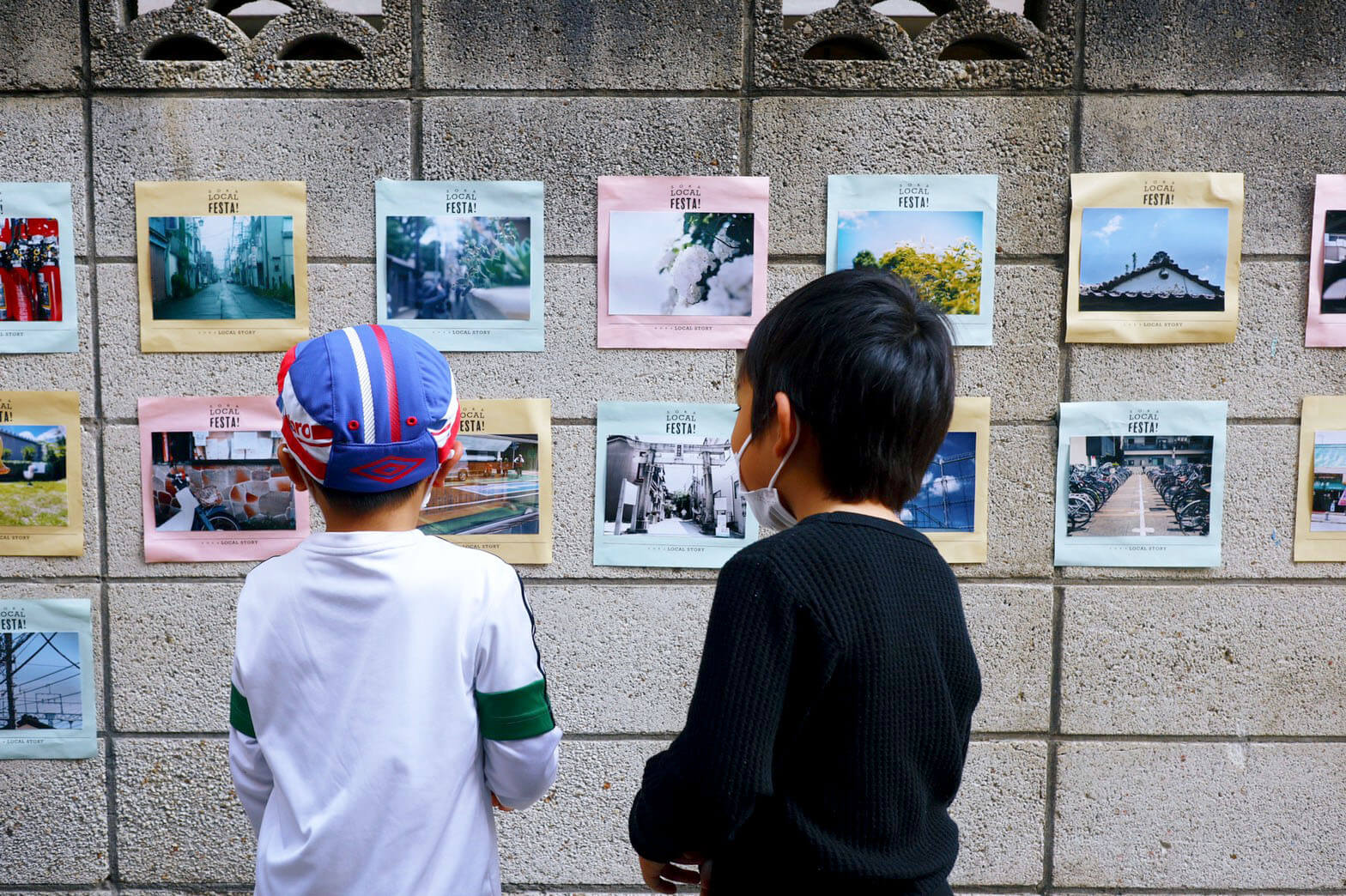 ローカルWEBメディア・地域サイト 草加ローカルストーリー 　草加ローカルフェスタリポート　草加カメラ部の写真を見る子供